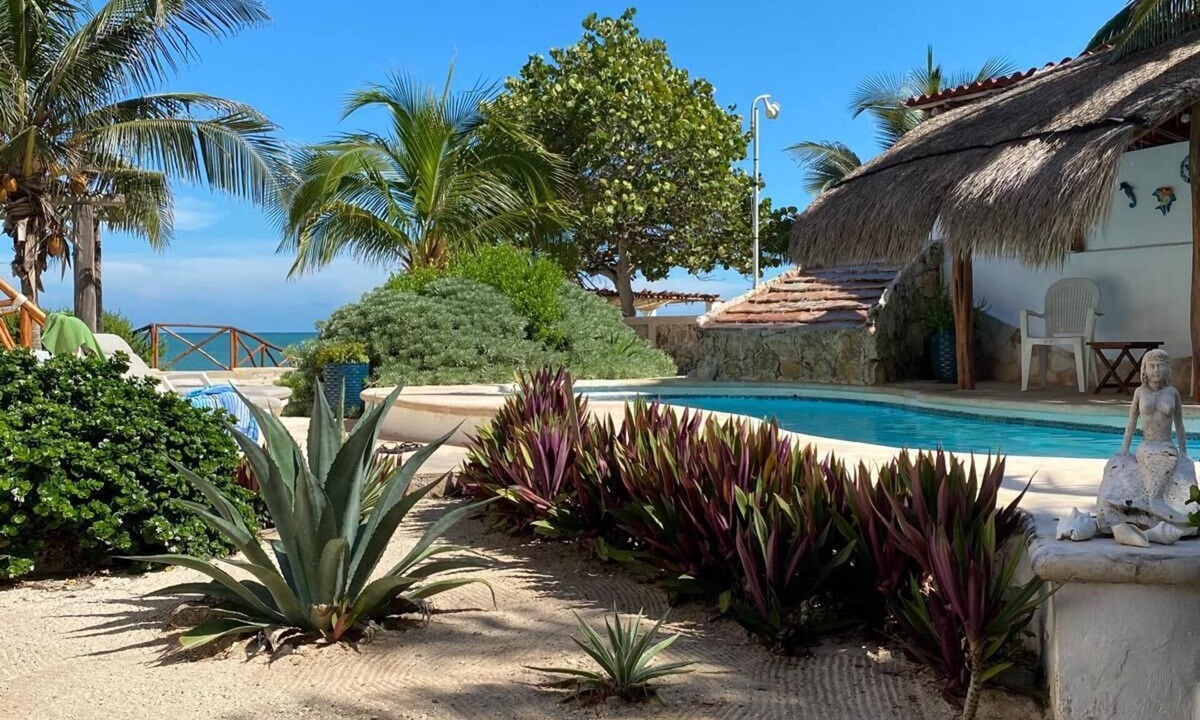 Merida House | Charming single level beachfront home! Garden oasis & private waterfall pool.