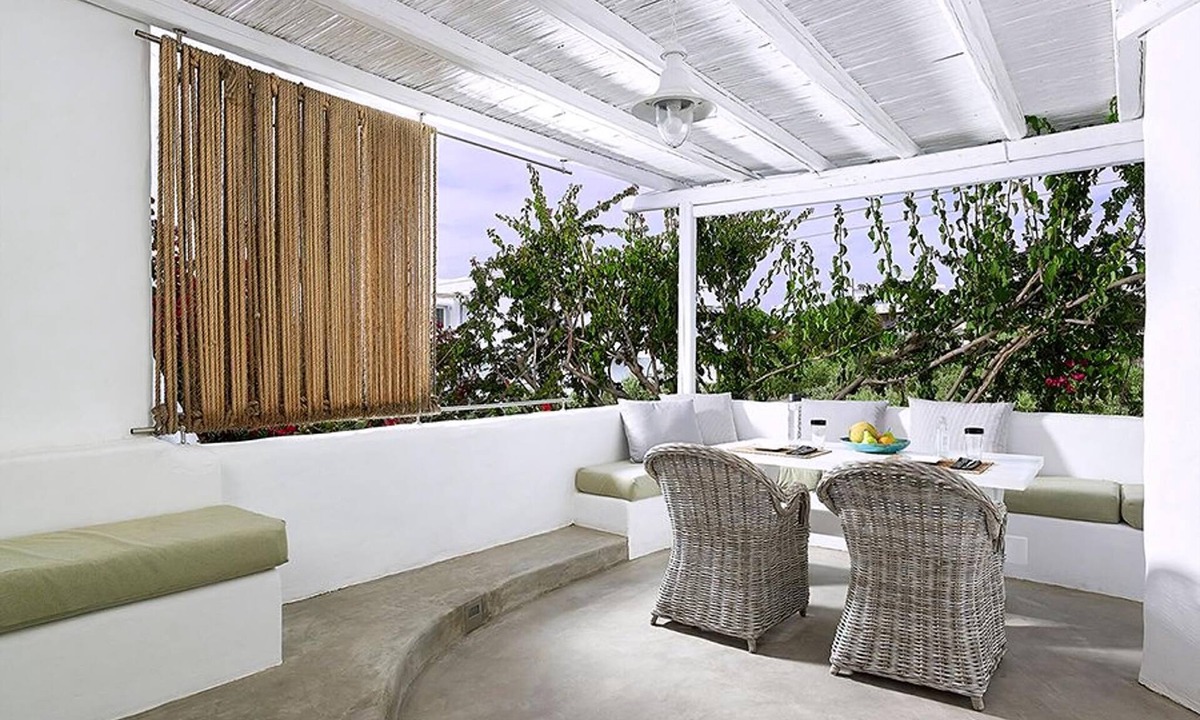 Apollonia Villa | Endearing Milos Suite | Cycladic Light Suite | Private Furnished Balcony | Outdoor Dining Area |.