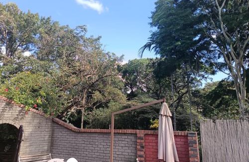 Ethekwini Apartment | Ground Floor apartment-2 x single beds, TV,kitchen, own bathroom, patio