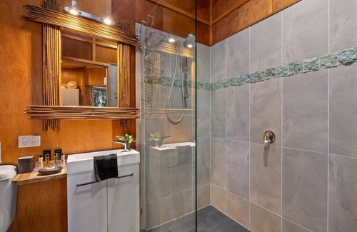 Tinbeerwah Resort | Orchid villa is decorated in Asian inspired décor with timber throughout