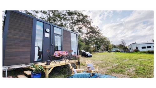Maleny House | White Jacaranda Tiny House by Tiny Away