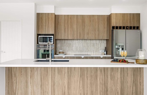Mooloolaba House | 7 bedroom home on canal with private jetty for casual fishing and separate living areas for the exte