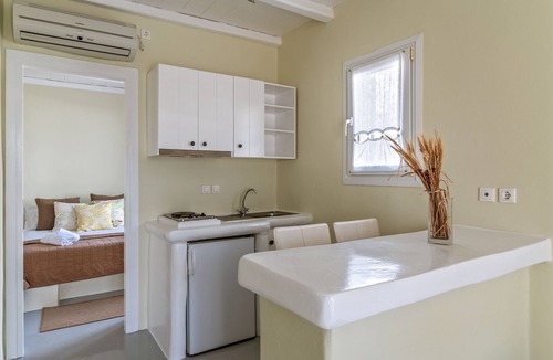 Kionia Apartment | Apartment In A Hotel 'Ninemia Suites Tinos Grand 105' with Shared Pool, Wi-Fi and Air Conditioning