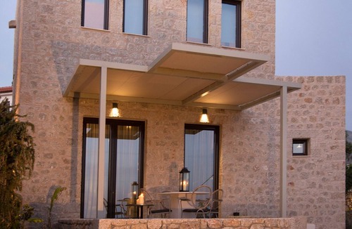 Stoupa Villa | Enjoy the relaxation of chic seaside living in a sea view stone villa