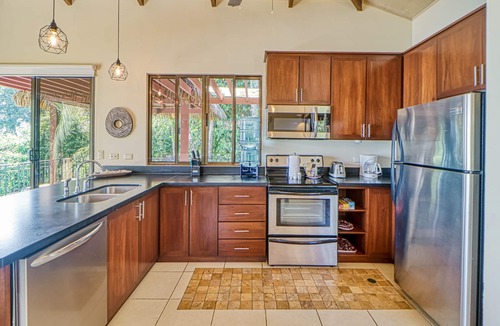 Dominicalito House | Exceptional Dog-Friendly Treetop Condo with Ocean Views & Breezy Balcony