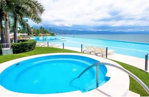 North Hotel Zone Condo | Gather your loved ones and pack your bags for the vacation of a life time!