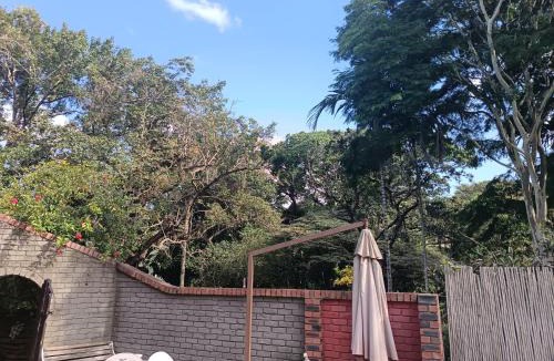 Ethekwini Apartment | Ground Floor apartment-2 x single beds, TV,kitchen, own bathroom, patio