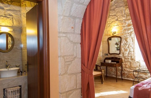 Psarou Villa | Kavos Psarou stone and wooden built sea front sea view traditional/lux villa