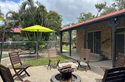 Jimboomba House | Kingfisher Lodge: country retreat with king beds, fireplace & pool on 2 acres