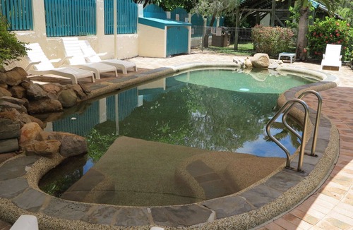 Arcadia Apartment | Magnetic Reef 3 - Relaxing tropical getaway with lush gardens and complex pool, minutes to Alma Bay