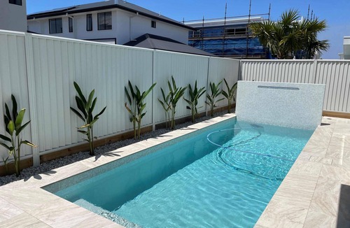 Pelican Waters House | Modern Boho Retreat with Pool, Yard & Beaches Just Minutes Away