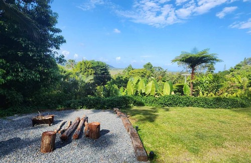 Miallo Cottage | NEW -The Sugar Shack, Ocean views over cane fields from your outdoor Spa Bath