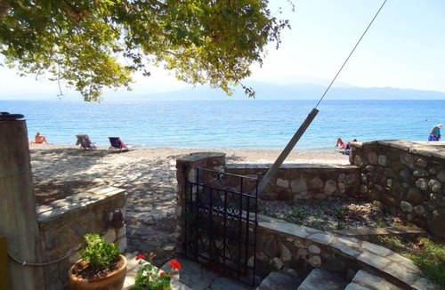 Skaloma Villa | Private beachfront villa in traditional village setting