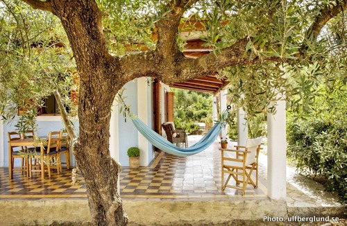 Vasilikos Cottage | Self catered cottage with large veranda and garden with hammock near the beach.
