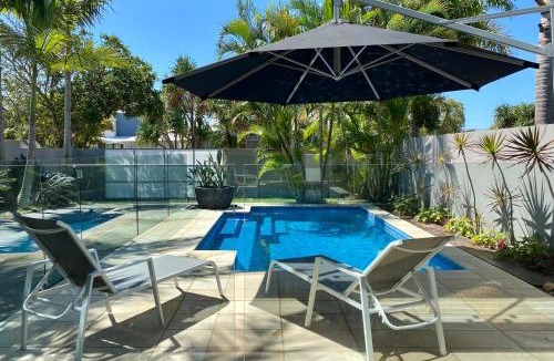 Mudjimba House | The Palm - Beachside Home with Heated Pool, Cinema & Games Room