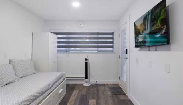 A small studio with a large backyard patio.